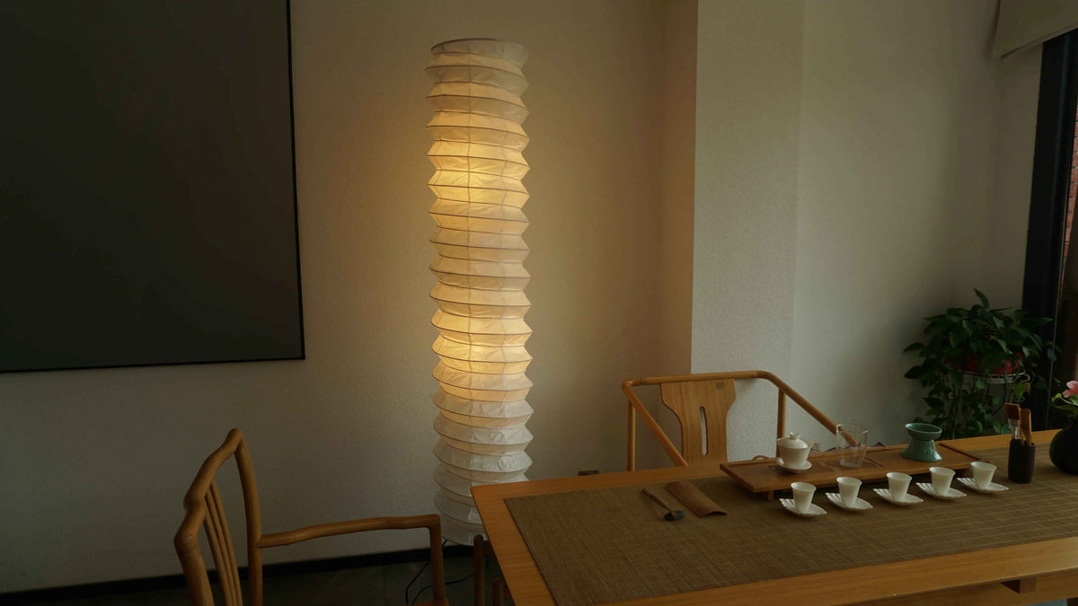 Noguchi UF3-31N Akari paper floor lamp lit in the corner of a dim Japandi tea room | Captains Bamboo