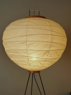 Akari 10D Floor Lamp — unlit shade filling the frame, showing creased washi and the wooden top cap — Captains Bamboo