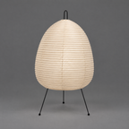 Akari 1A Table Lamp — unlit washi paper shade with black tripod legs on grey studio backdrop — Captains Bamboo