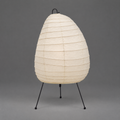 Akari 1N Table Lamp — unlit egg-shaped shade on three thin wire legs, grey studio backdrop — Captains Bamboo