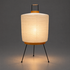 Akari 2A Table Lamp — same lamp lit, warm glow spreading onto the floor — Captains Bamboo