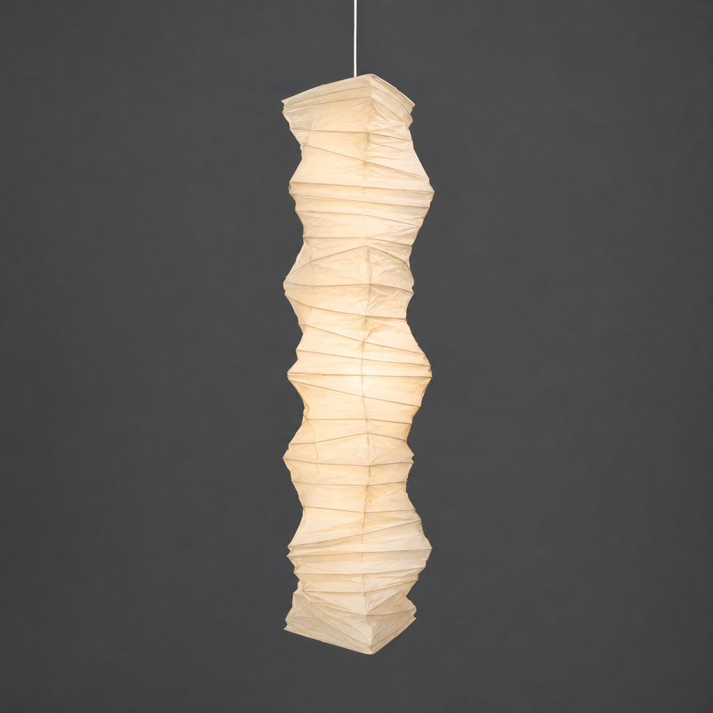 Akari 33N Paper Ceiling Lamp — lit wrinkled paper shade glowing warm on a dark gray studio background — Captains Bamboo