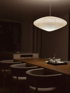 Akari pendant lamp casting warm ambient light in living room